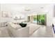 Bright living room opens to an outdoor pool area with a large sectional sofa at 454 Rosina Vista St, Las Vegas, NV 89138