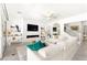 Living room features a large couch, fireplace, and staircase in an open layout at 454 Rosina Vista St, Las Vegas, NV 89138
