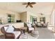Wide covered patio with fireplace, furniture, outdoor kitchen and seating at 454 Rosina Vista St, Las Vegas, NV 89138