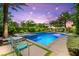 Backyard pool and spa area with elegant lounge furniture, set against manicured landscaping at 454 Rosina Vista St, Las Vegas, NV 89138