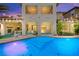 Backyard pool and patio area with an upper-level balcony overlooking the pool with glass safety barrier at 454 Rosina Vista St, Las Vegas, NV 89138