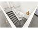 Carpeted staircase with white railings and white walls at 454 Rosina Vista St, Las Vegas, NV 89138