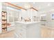 Bright walk-in closet with center island, custom cabinets, and window bench at 454 Rosina Vista St, Las Vegas, NV 89138