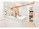 Walk-in closet with center island, custom cabinets, shelving, and chandelier at 454 Rosina Vista St, Las Vegas, NV 89138