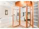 Walk-in closet with mirrored cabinets and access to tub and vanity at 454 Rosina Vista St, Las Vegas, NV 89138