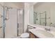 Bathroom featuring shower over bath with glass screen, toilet, and vanity unit at 4744 Deer Forest Ave, Las Vegas, NV 89139