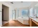 Bathroom with separate shower and bath, and wooden cabinets at 4744 Deer Forest Ave, Las Vegas, NV 89139
