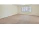Bedroom features neutral carpeting and a bright window at 4744 Deer Forest Ave, Las Vegas, NV 89139
