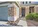 Welcoming front entrance with stone accents, a well-manicured walkway, and verdant landscaping at 4744 Deer Forest Ave, Las Vegas, NV 89139