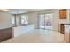 Living room area with sliding glass doors to the exterior and neutral flooring and paint at 4744 Deer Forest Ave, Las Vegas, NV 89139