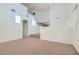 Spacious Living Room with soaring ceilings, neutral carpet and paint and a stairway to the second floor at 4744 Deer Forest Ave, Las Vegas, NV 89139