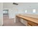 Bright loft area featuring neutral carpet and built-in wooden desk, perfect for a home office at 4744 Deer Forest Ave, Las Vegas, NV 89139