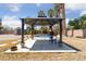 Charming outdoor space featuring a gazebo, waterfall feature, and inviting pool at 4883 Grey Mesa St, Las Vegas, NV 89149