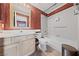 Bathroom with tiled walls, shower, toilet, mirror, sink and storage cabinet at 4883 Grey Mesa St, Las Vegas, NV 89149