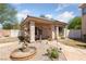 Charming casita with front yard fountain and a stone walkway leading to the front door at 4883 Grey Mesa St, Las Vegas, NV 89149