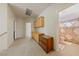 Hallway with built-in cabinets, drawers and adjacent bathroom with shower-tub combo at 4883 Grey Mesa St, Las Vegas, NV 89149