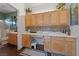 Bright kitchen with wooden cabinetry, ample counter space, and a functional design at 4883 Grey Mesa St, Las Vegas, NV 89149
