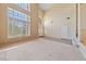 Spacious living room featuring tall ceilings, large windows, and an open airy feel at 4883 Grey Mesa St, Las Vegas, NV 89149