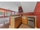 Wet bar with sink, mini fridge, and cabinet storage located off the dining area at 4883 Grey Mesa St, Las Vegas, NV 89149