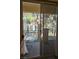 Balcony with sliding glass doors overlooks well-maintained landscaping at 5155 W Tropicana Ave # 2140, Las Vegas, NV 89103