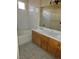 Bathroom featuring double sinks, tile flooring, and a bath tub with a tile surround at 5155 W Tropicana Ave # 2140, Las Vegas, NV 89103