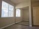 Bedroom with big windows and sliding mirror door closet at 5155 W Tropicana Ave # 2140, Las Vegas, NV 89103