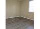 Bedroom featuring wood flooring and a sunlit window at 5155 W Tropicana Ave # 2140, Las Vegas, NV 89103