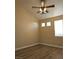 Bedroom with wood flooring, two windows and overhead fan with lighting at 5155 W Tropicana Ave # 2140, Las Vegas, NV 89103