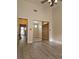 Bedroom with wood floors, ceiling fan, mirrored closet doors, and natural light at 5155 W Tropicana Ave # 2140, Las Vegas, NV 89103