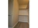 Walk-in closet featuring built-in shelving for optimal storage at 5155 W Tropicana Ave # 2140, Las Vegas, NV 89103