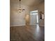 Bright living room features new flooring and a ceiling fan with decorative lighting at 5155 W Tropicana Ave # 2140, Las Vegas, NV 89103