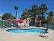 Community pool with lounge chairs, BBQ and manicured landscaping offering a great outdoor space at 5155 W Tropicana Ave # 2140, Las Vegas, NV 89103