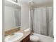Functional bathroom with granite countertop, white sink, toilet, and a shower with a gray curtain at 5166 S Jones Blvd # 205, Las Vegas, NV 89118