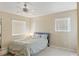 Cozy bedroom with neutral walls, a ceiling fan, and plenty of natural light from two windows at 5166 S Jones Blvd # 205, Las Vegas, NV 89118