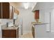 Well-equipped kitchen with white appliances, dark wood cabinets, and granite countertops at 5166 S Jones Blvd # 205, Las Vegas, NV 89118