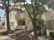 Charming condo featuring a private entrance, complemented by mature trees and inviting curb appeal at 5222 Mandalay Springs Dr # 202, Las Vegas, NV 89120