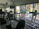 Well-equipped fitness center with treadmills and exercise equipment overlooking the neighborhood at 5222 Mandalay Springs Dr # 202, Las Vegas, NV 89120