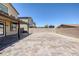 Spacious backyard featuring stone tile and a covered patio at 5966 Icicle Falls Ave, Las Vegas, NV 89130