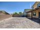 Spacious backyard showcasing a patterned paver patio with ample room for various activities at 5966 Icicle Falls Ave, Las Vegas, NV 89130