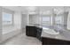 Bathroom features granite countertops, dual sinks, and separate soaking tub at 5966 Icicle Falls Ave, Las Vegas, NV 89130