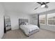 Bright bedroom featuring neutral tones, contemporary ceiling fan and a comfortable king-size bed at 5966 Icicle Falls Ave, Las Vegas, NV 89130