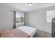 Bedroom filled with natural light and stylish dark wood furniture at 5966 Icicle Falls Ave, Las Vegas, NV 89130