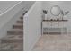 Inviting entryway with tile floors, staircase, and decorative console table at 5966 Icicle Falls Ave, Las Vegas, NV 89130
