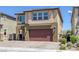 Charming two-story home with a two-car garage and inviting front entry at 5966 Icicle Falls Ave, Las Vegas, NV 89130