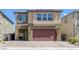 Charming two-story home with a two-car garage and inviting front entry at 5966 Icicle Falls Ave, Las Vegas, NV 89130
