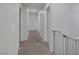 Upstairs hallway with neutral walls and carpeting at 5966 Icicle Falls Ave, Las Vegas, NV 89130