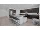 Eat in kitchen features granite countertops and dark wood cabinets at 5966 Icicle Falls Ave, Las Vegas, NV 89130