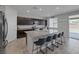 Eat in kitchen features granite countertops and dark wood cabinets at 5966 Icicle Falls Ave, Las Vegas, NV 89130
