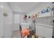 Bright laundry room with washer, dryer, storage, and functional shelving at 5966 Icicle Falls Ave, Las Vegas, NV 89130