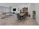 Open living room with tile floors, dining area, and comfortable seating at 5966 Icicle Falls Ave, Las Vegas, NV 89130